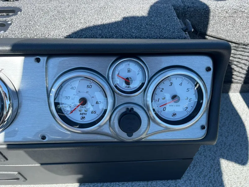 Slide: The Image of Dashboard gauges of a 2025 Lund 1875 Pro Guide boat. - 15