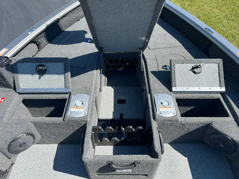 Slide: The Image of 2025 Lund 1875 Pro Guide boat interior with open storage compartments. - 16
