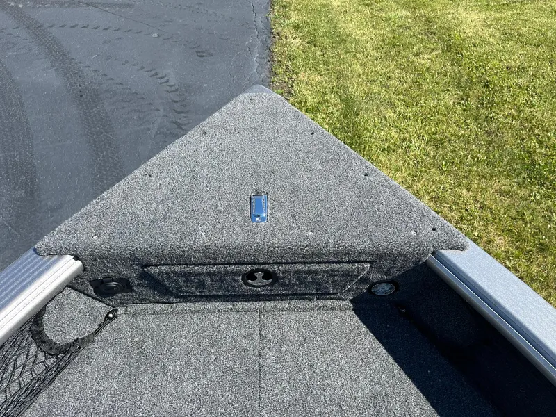 Slide: The Image of 2025 Lund 1875 Pro Guide boat bow with carpeted deck. - 18