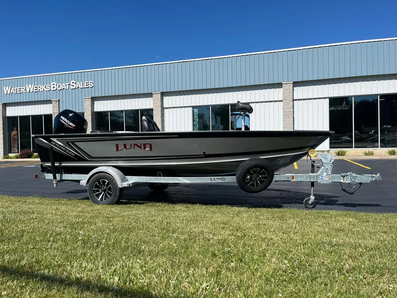 Slide: The Image of 2025 Lund 1875 Pro Guide boat on trailer outside Water Werks Boat Sales. - 2