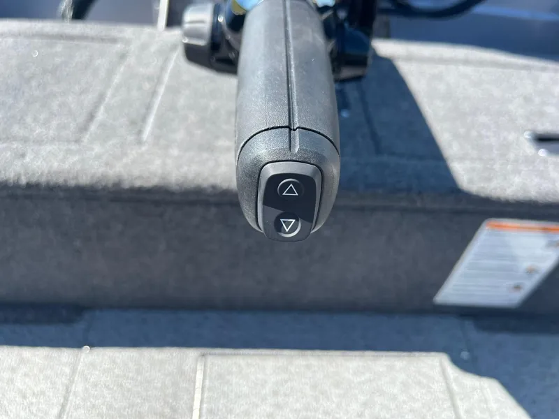Slide: The Image of Close-up of the control handle on a 2025 Lund 1875 Pro Guide boat. - 20