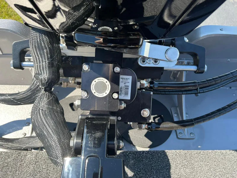 Slide: The Image of Close-up of the engine components on a 2025 Lund 1875 Pro Guide boat. - 24