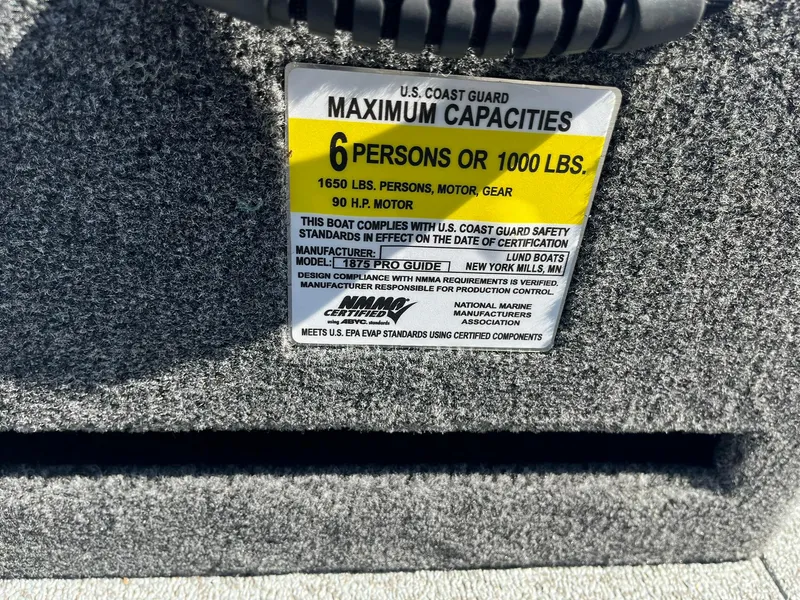 Slide: The Image of 2025 Lund 1875 Pro Guide boat capacity label, 6 persons or 1000 lbs, 90 HP motor. - 26