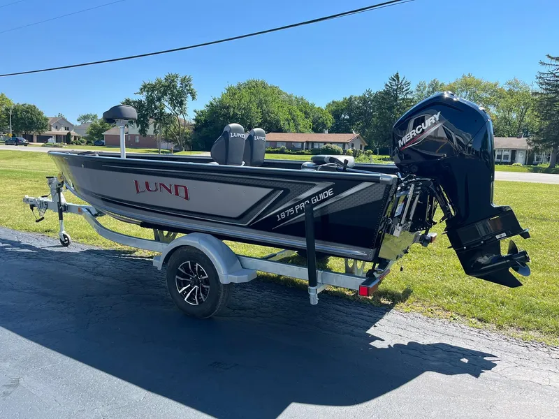 Slide: The Image of 2025 Lund 1875 Pro Guide fishing boat with Mercury outboard motor. - 3
