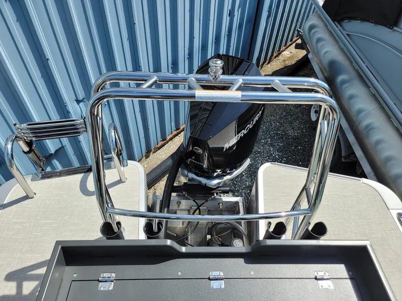 Slide: The Image of 2025 Harris Cruiser 230 boat with Mercury outboard motor, rear view. - 22