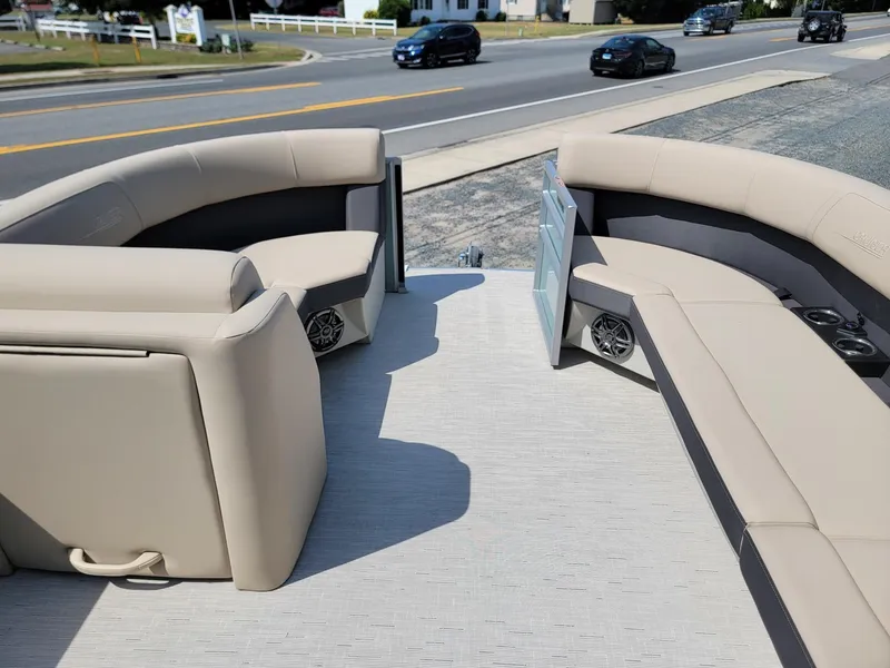 Slide: The Image of 2025 Harris Cruiser 230 boat interior with beige seating and modern design. - 28