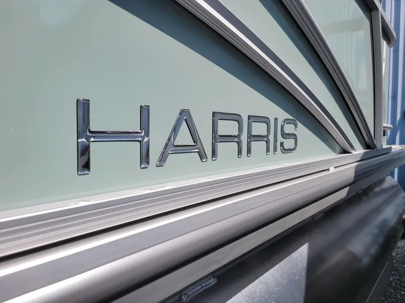 Slide: The Image of Close-up of 2025 Harris Cruiser 230 boat logo. - 31