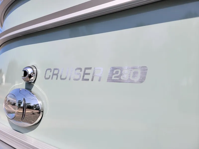 Slide: The Image of 2025 Harris Cruiser 230 boat model nameplate. - 33