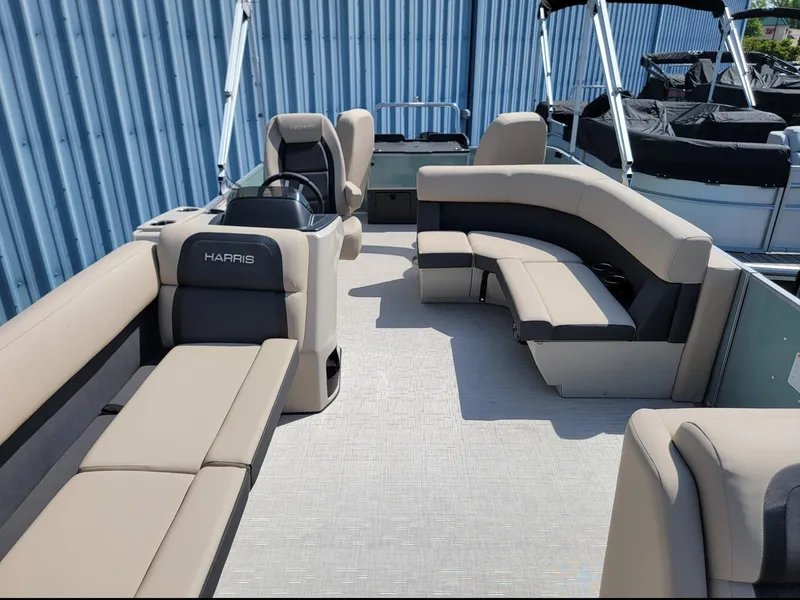 Slide: The Image of 2025 Harris Cruiser 230 pontoon boat with spacious seating and modern design. - 6