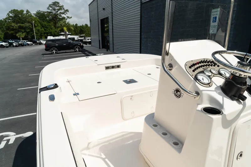 Slide: The Image of 2024 Carolina Skiff 17 LS boat interior with console and seating area. - 13