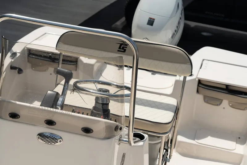 Slide: The Image of 2024 Carolina Skiff 17 LS boat interior with steering wheel and seating. - 17