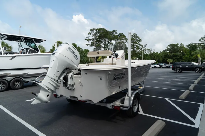 Slide: The Image of 2024 Carolina Skiff 17 LS boat on trailer in parking lot. - 3