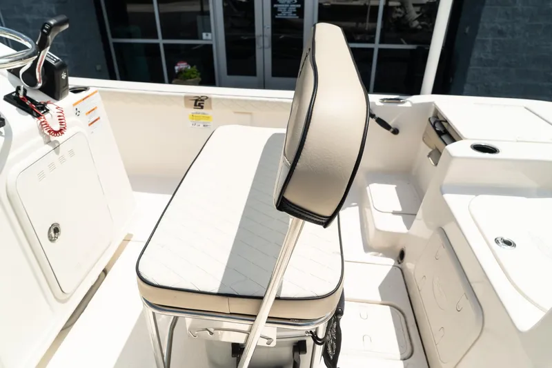 Slide: The Image of 2024 Carolina Skiff 17 LS boat interior with cushioned seating and control console. - 8