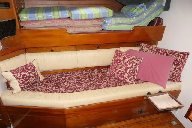 Slide: The Image of Cozy cabin interior of 1970 Southern Ocean GALLANT 53 with patterned cushions and bedding. - 16