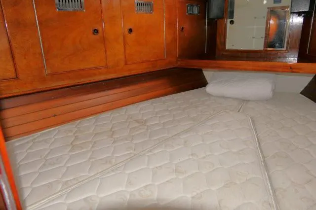 Slide: The Image of 1970 Southern Ocean GALLANT 53 yacht cabin with wooden cabinets and mattress. - 26