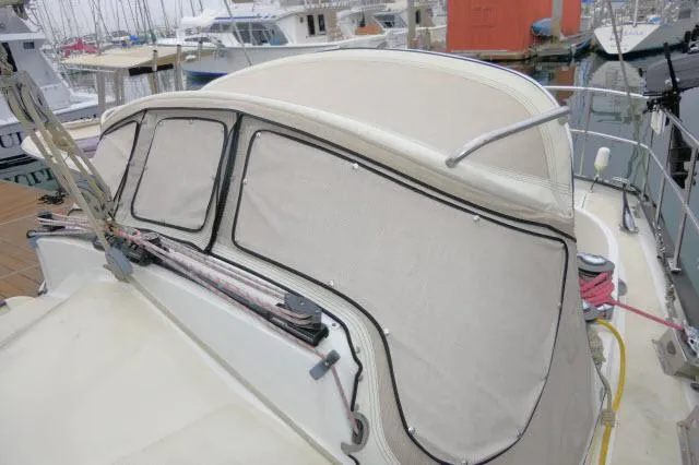 Slide: The Image of 1970 Southern Ocean GALLANT 53 sailboat with covered cockpit at marina. - 46