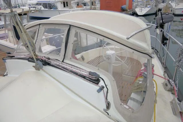 Slide: The Image of 1970 Southern Ocean GALLANT 53 sailboat cockpit and helm at marina. - 47