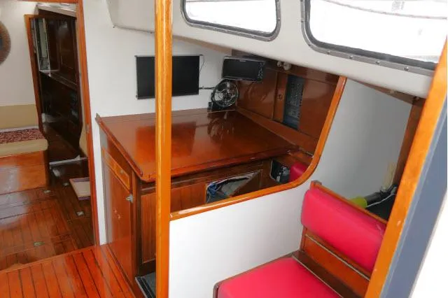 Slide: The Image of Interior of 1970 Southern Ocean GALLANT 53 sailboat with wooden furnishings and red seating. - 8