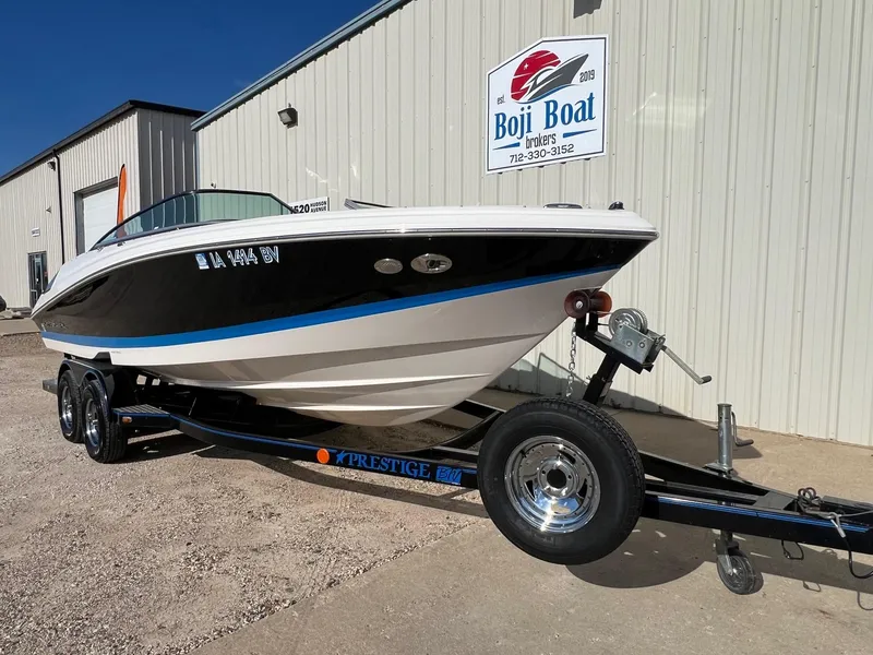 Slide: The Image of 2006 Regal 2200 Bowrider boat on a trailer at Boji Boat Brokers. - 1