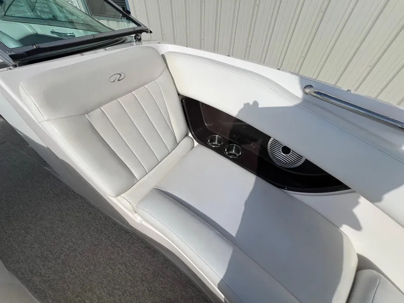 Slide: The Image of 2006 Regal 2200 Bowrider interior seating with cup holders and speaker. - 10