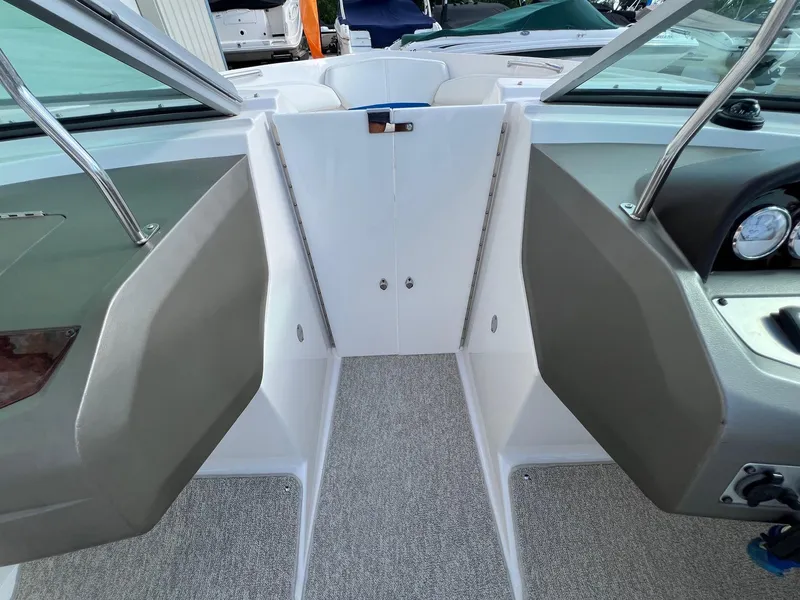 Slide: The Image of Interior view of a 2006 Regal 2200 Bowrider boat cockpit area. - 11