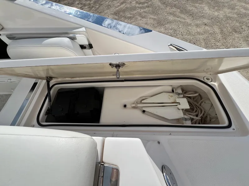 Slide: The Image of Open storage compartment on a 2006 Regal 2200 Bowrider boat. - 25