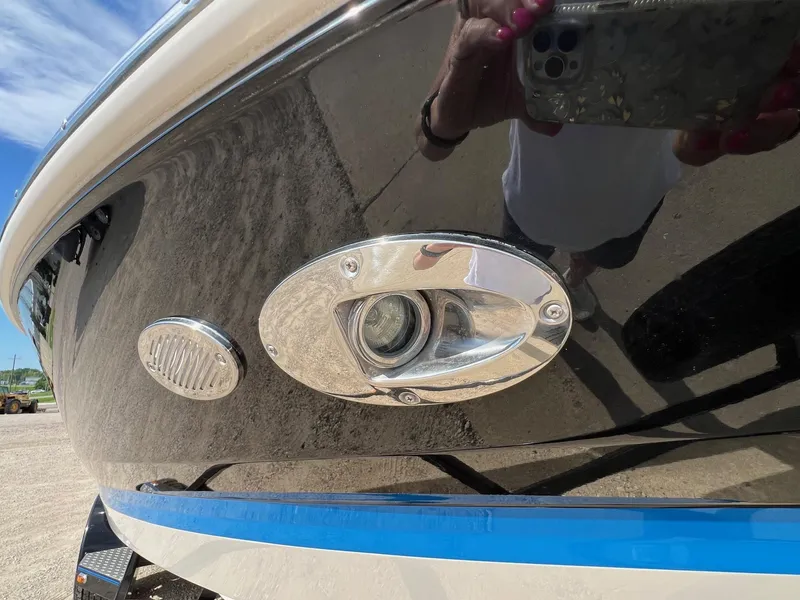 Slide: The Image of Close-up of a 2006 Regal 2200 Bowrider boat's exterior light and speaker. - 30