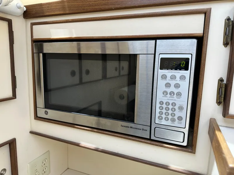 Slide: The Image of Built-in microwave in 1985 Hatteras 36 Convertible yacht kitchen. - 21