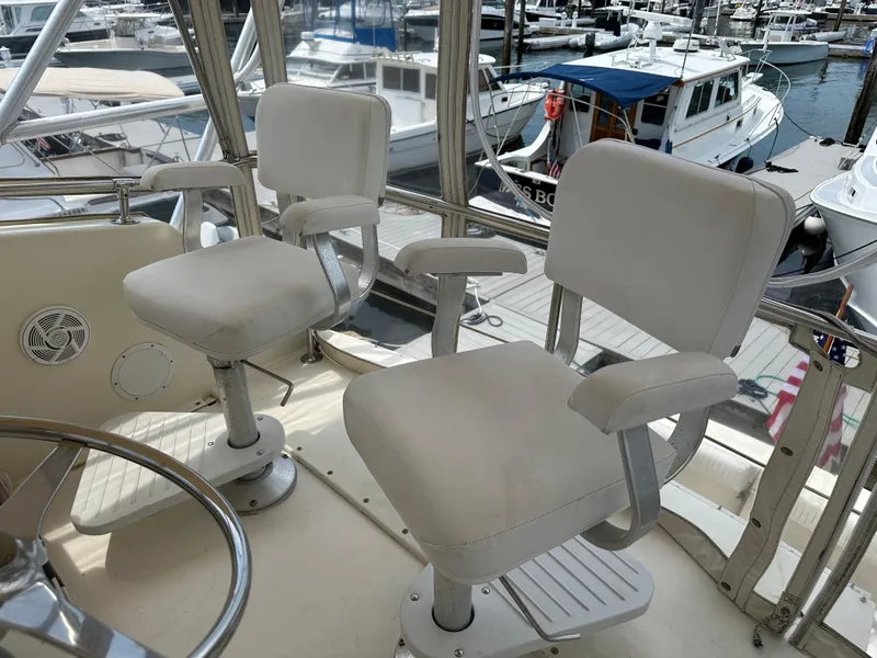 Slide: The Image of Two captain's chairs on the 1985 Hatteras 36 Convertible yacht's flybridge. - 40