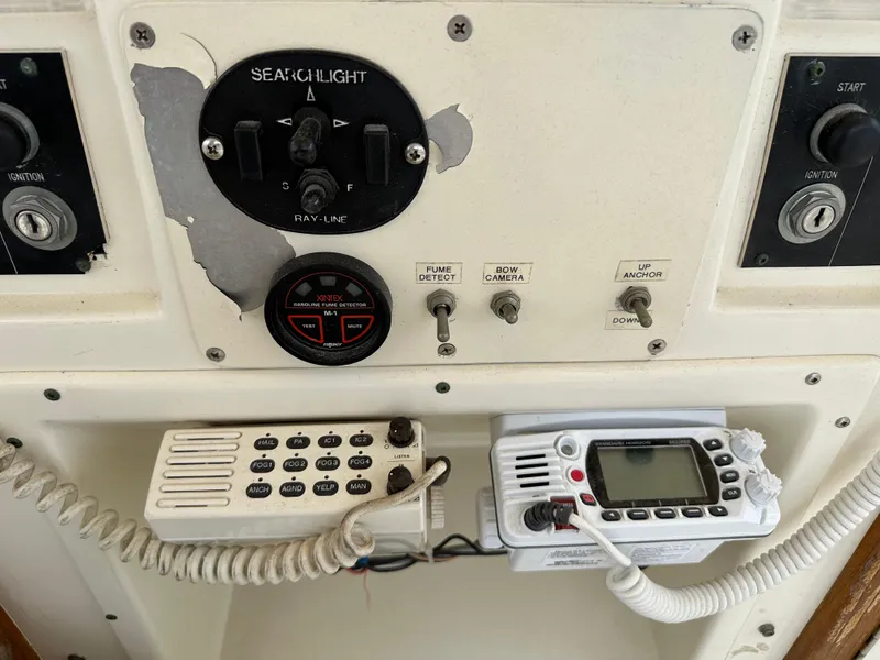 Slide: The Image of Control panel of a 1985 Hatteras 36 Convertible boat with radio and switches. - 46