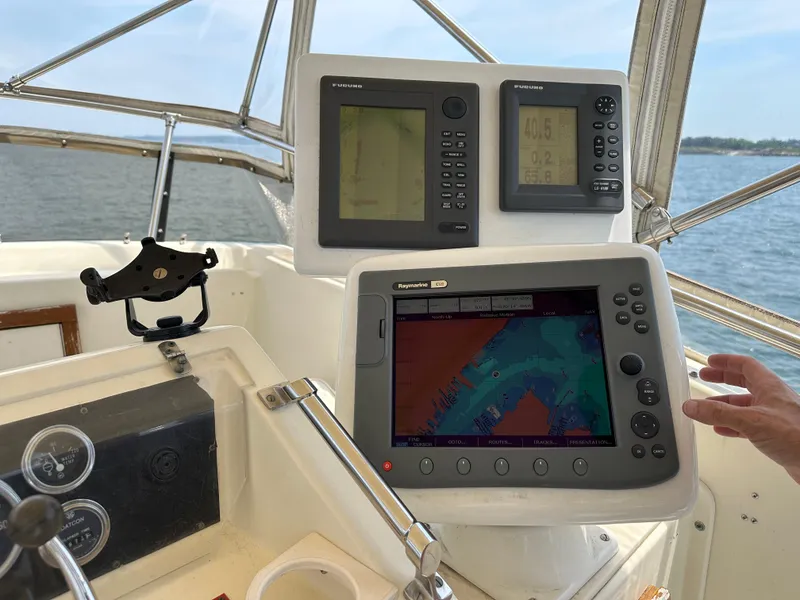 Slide: The Image of Helm of 1985 Hatteras 36 Convertible with navigation equipment. - 47