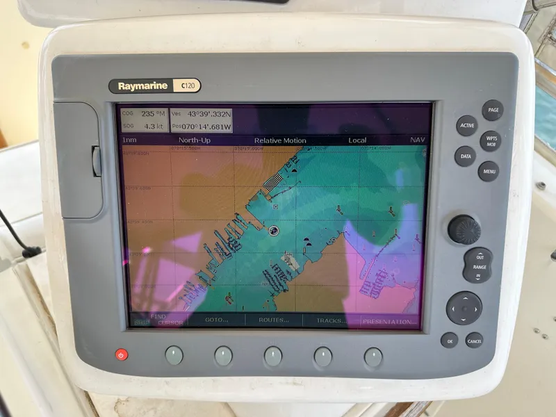 Slide: The Image of Raymarine E120 chartplotter on 1985 Hatteras 36 Convertible boat. - 48