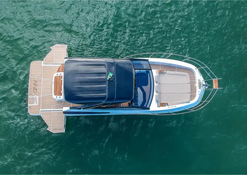 Slide: The Image of Aerial view of 2025 NHD 325 Open Deck boat on water. - 5