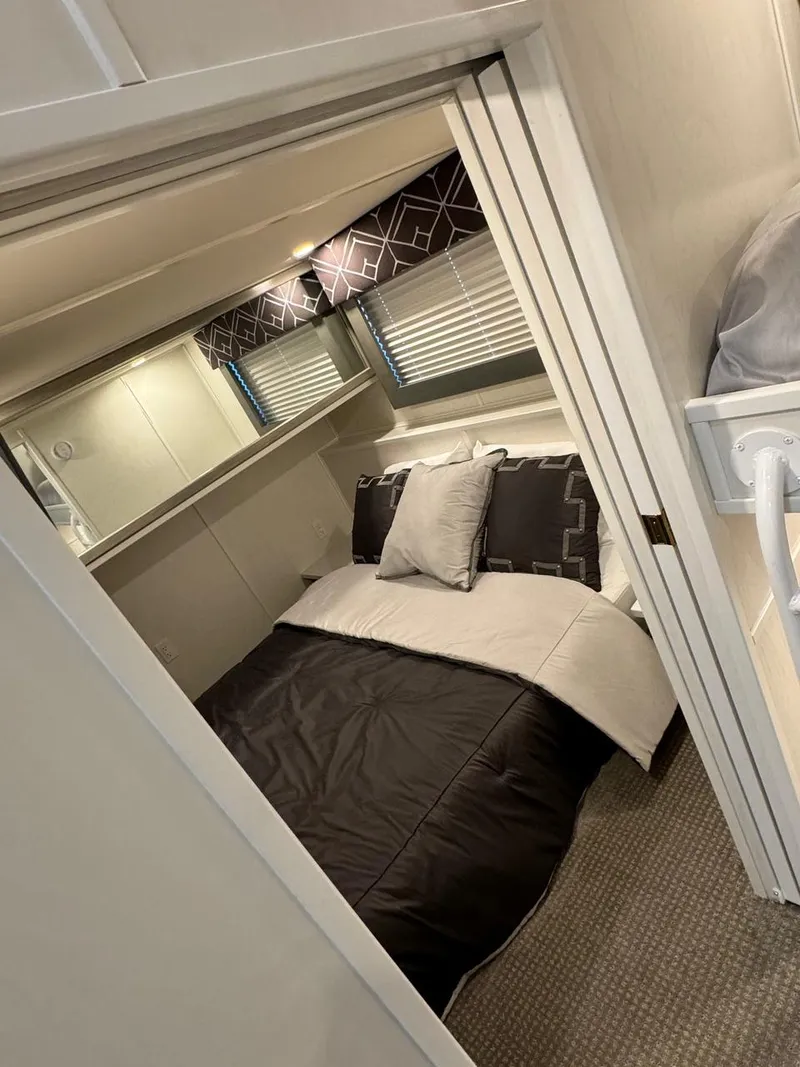 Slide: The Image of 2024 Sumerset Limitless Share 10 bedroom with modern decor and cozy bedding. - 11