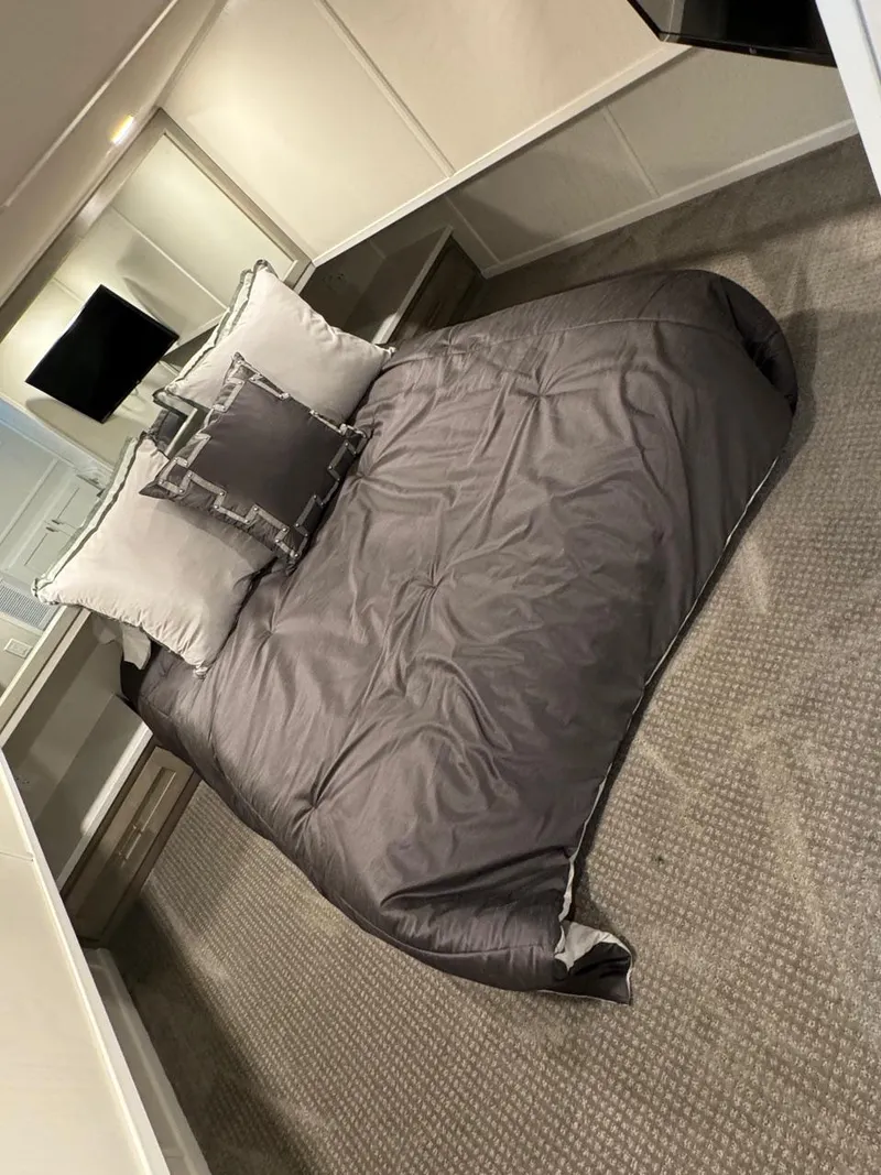 Slide: The Image of 2024 Sumerset Limitless Share 10 bedroom with modern decor and comfortable bedding. - 14