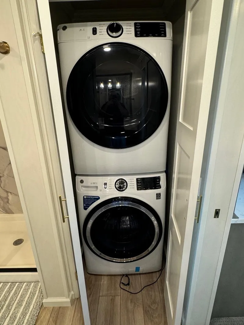 Slide: The Image of 2024 Sumerset Limitless Share 10 stacked washer and dryer in a closet. - 17