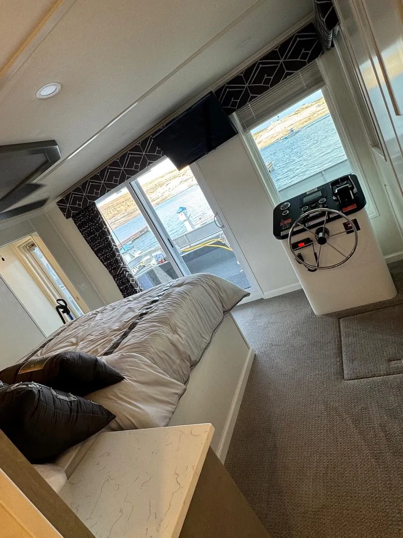 Slide: The Image of 2024 Sumerset Limitless Share 10 bedroom with waterfront view and modern decor. - 18