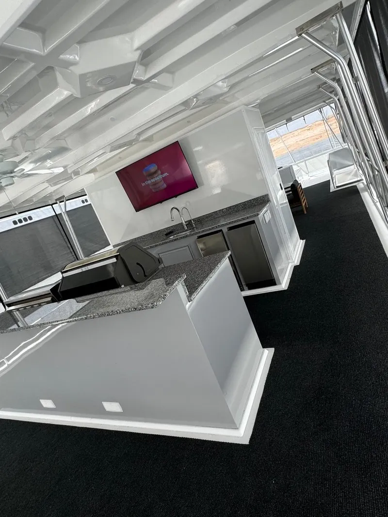 Slide: The Image of 2024 Sumerset Limitless Share 10 houseboat interior with modern kitchen and entertainment area. - 23