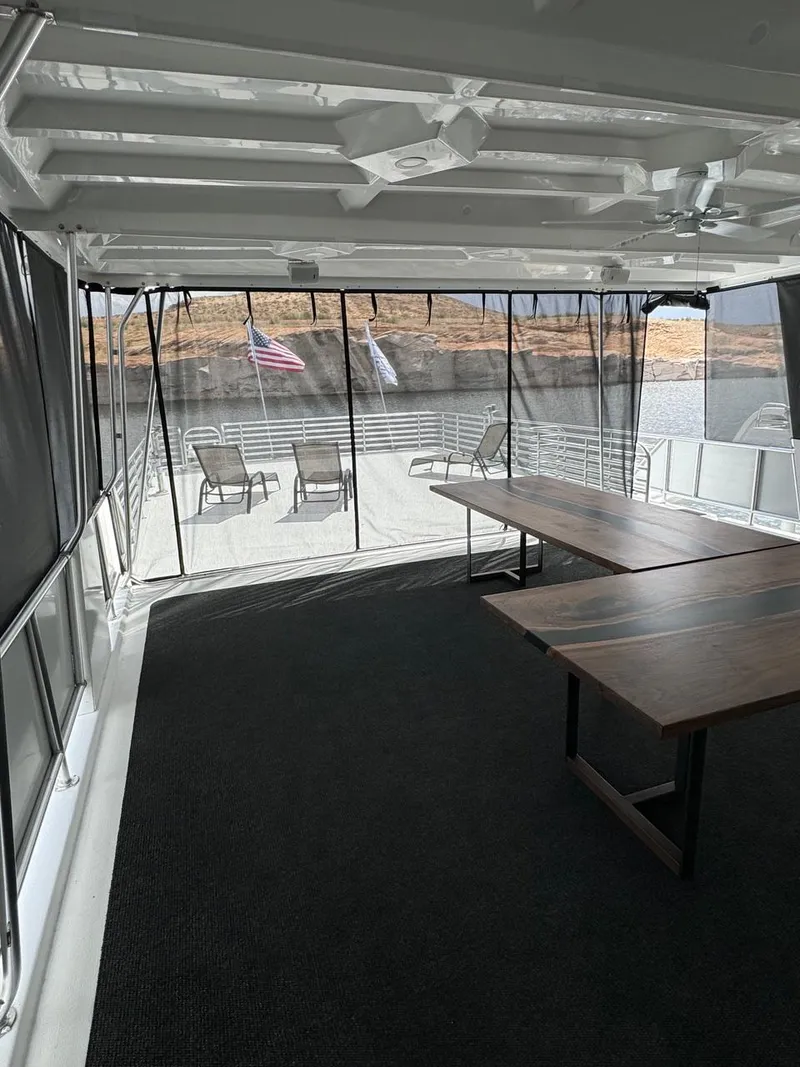 Slide: The Image of 2024 Sumerset Limitless Share 10 houseboat interior with lake view. - 24