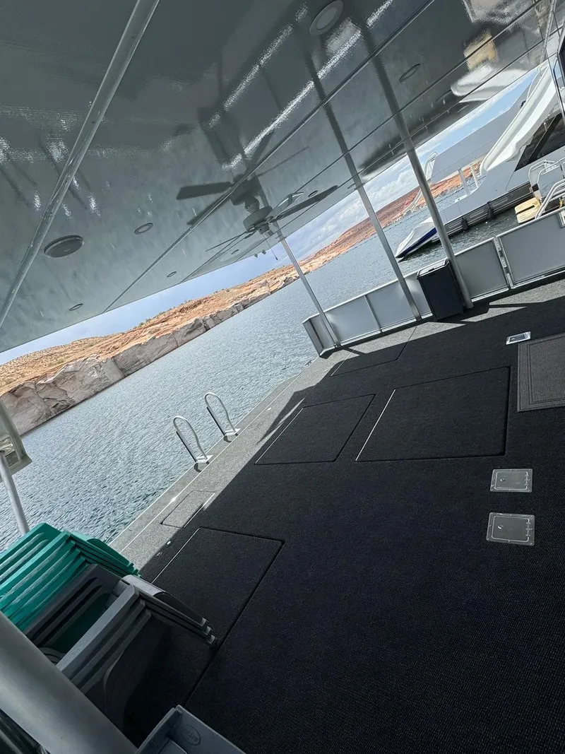 Slide: The Image of 2024 Sumerset Limitless Share 10 houseboat deck with lake view. - 3