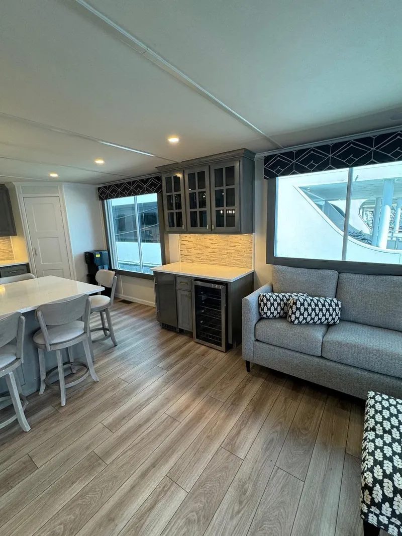 Slide: The Image of 2024 Sumerset Limitless Share 10 interior with modern kitchen and cozy living area. - 4