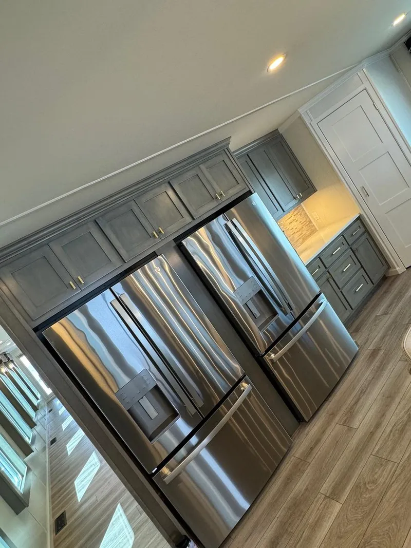 Slide: The Image of Modern kitchen in 2024 Sumerset Limitless Share 10 houseboat with stainless steel appliances. - 7