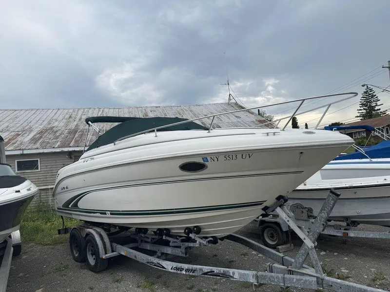 Slide: The Image of 1999 Sea Ray Weekender 240 boat on a trailer, ready for transport. - 3