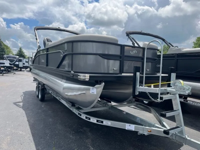 The Image of 2024 Barletta Cabrio Ultra Lounge C24UC pontoon boat on a trailer under a cloudy sky. - 0