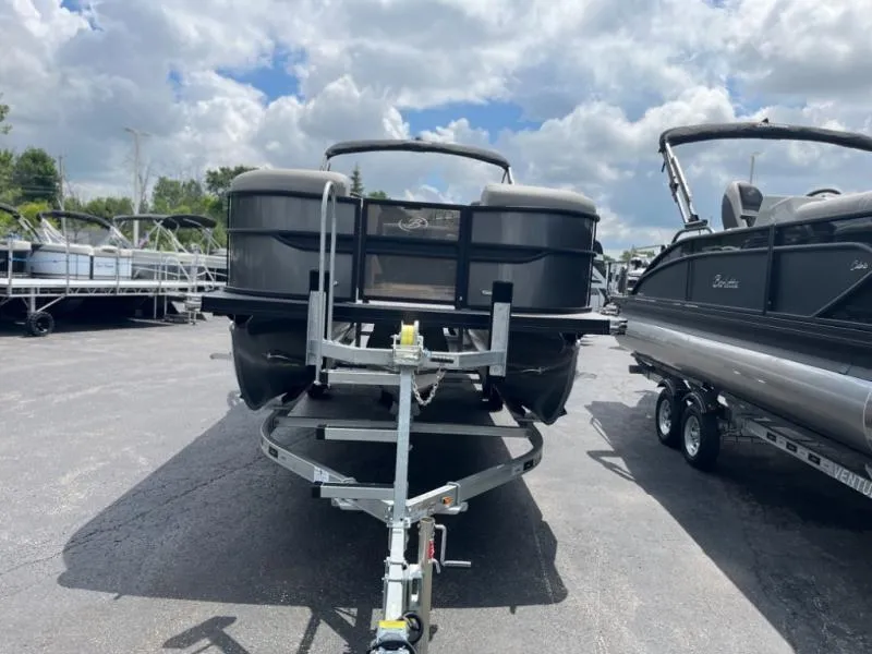 Slide: The Image of 2024 Barletta Cabrio Ultra Lounge C24UC pontoon boat on a trailer, ready for transport. - 2