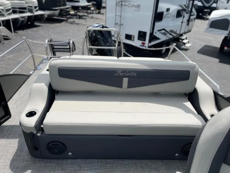 Slide: The Image of 2024 Barletta Cabrio Ultra Lounge C24UC boat interior with cushioned seating. - 8