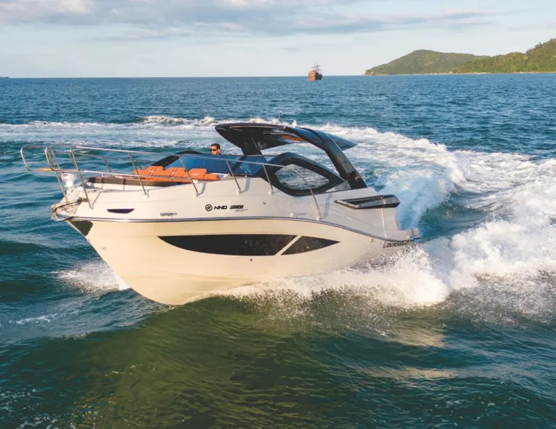 Slide: The Image of Luxury NHD 355 All Space boat cruising on open water, 2025 model. - 0