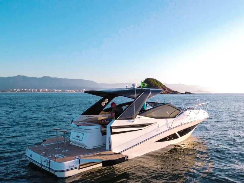 Slide: The Image of Luxury NHD 355 All Space 2025 yacht cruising on serene waters at sunset. - 1