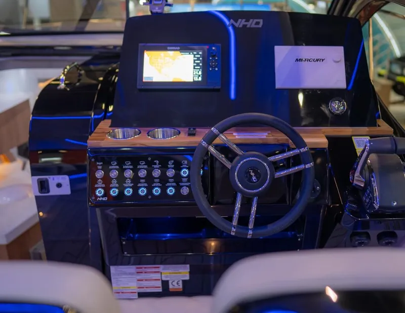 Slide: The Image of Control panel of NHD 355 All Space boat, 2025 model, featuring advanced navigation system and steering wheel. - 3
