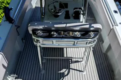 Slide: The Image of 2003 Contender 31 Open boat interior with steering console and rod holders. - 11